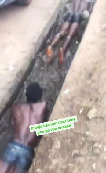 This is Wrong – Nigerians Complain As Soldier Orders Two Men to Swim in Dirty Water (Video)
